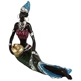 Décoration africaine pour la maison : artisanat et souci du détail, témoignant d’un engagement envers la qualité et l’esthétique, statue de dame
