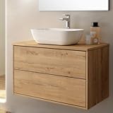 La encimera es una tapa plana hidrófuga sin calados, para que puedas poner el lavabo que quieras y la grifería donde más te guste.