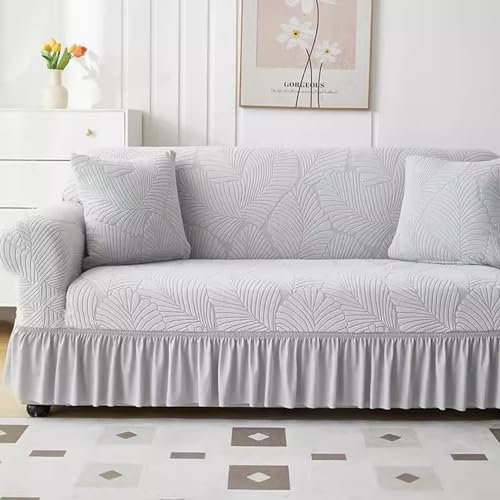 Housse de canapé extensible gris clair : rénover un modèle sans espace