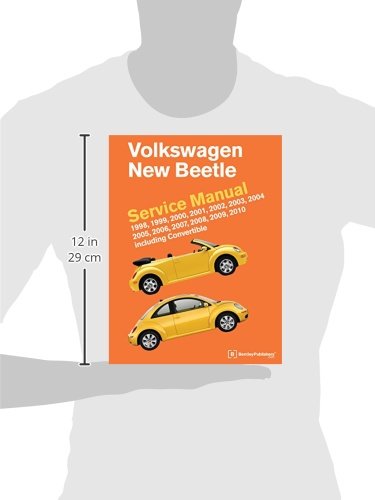 Service manual next to a ruler showing its dimensions