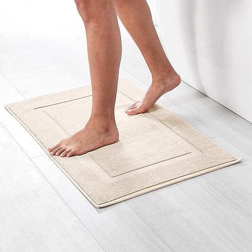 Image of Amazon Basics Banded Bathroom Bath Rug Mat, Machine Washable, Super Absorbent, 100% Cotton, 20 inch W x 31 inch L, Cream (Pack of 2)