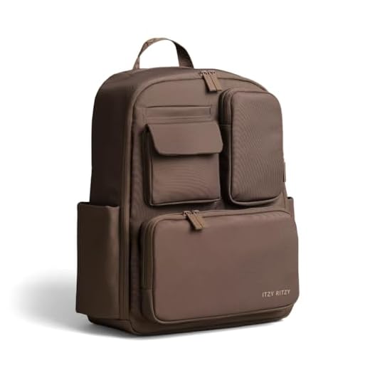 Itzy Ritzy Utility Diaper Bag Backpack – Features 17 Pockets (Including 2 Insulated Bottle Holders) & Trolley Sleeve and Includes Stroller Straps & Changing Pad – Part of the Belong Collection (Mocha)