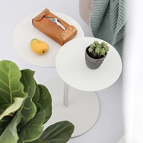 Table basse ronde blanche compacte pour optimiser les petits salons