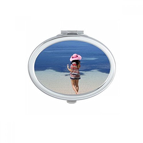 Miroir de maquillage compact ovale pour retouches faciles avec motif plage