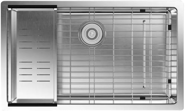 Top-down view of the Gappo kitchen sink showing the stainless steel grid and colander in place.
