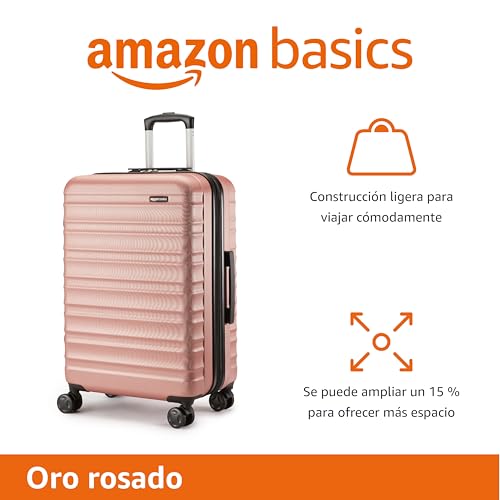 Maleta Amazon Basics color oro rosado destacando las características de construcción ligera y capacidad ampliable