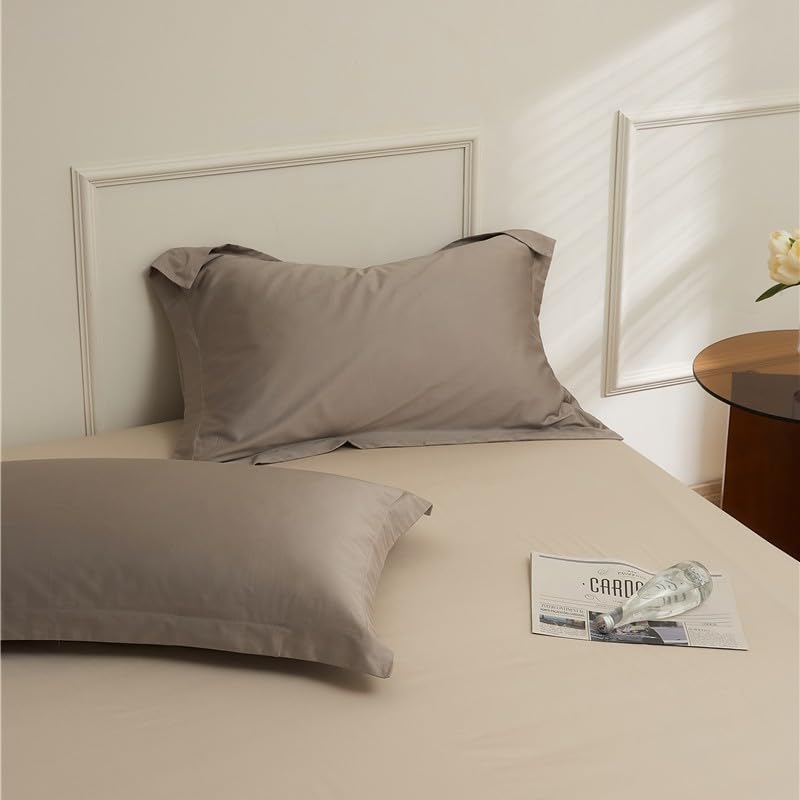 Taies d'oreiller en coton pour des nuits sereines dans une chambre cosy
