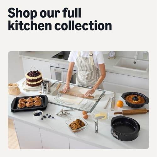 Image of Amazon Basics Nonstick Carbon Steel Fluted Cake Pan, Dishwasher and Oven-Safe, 10 inch, Black