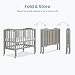 Dream On Me 2-in-1 Folding Portable Compact Mini Baby Crib in Cool Grey, GreenGuard Gold & BSA, US Patented Flat Folding System, Locking Wheels, 1″ Mattress Pad, Space-Saving Quck Fold Easy Storage