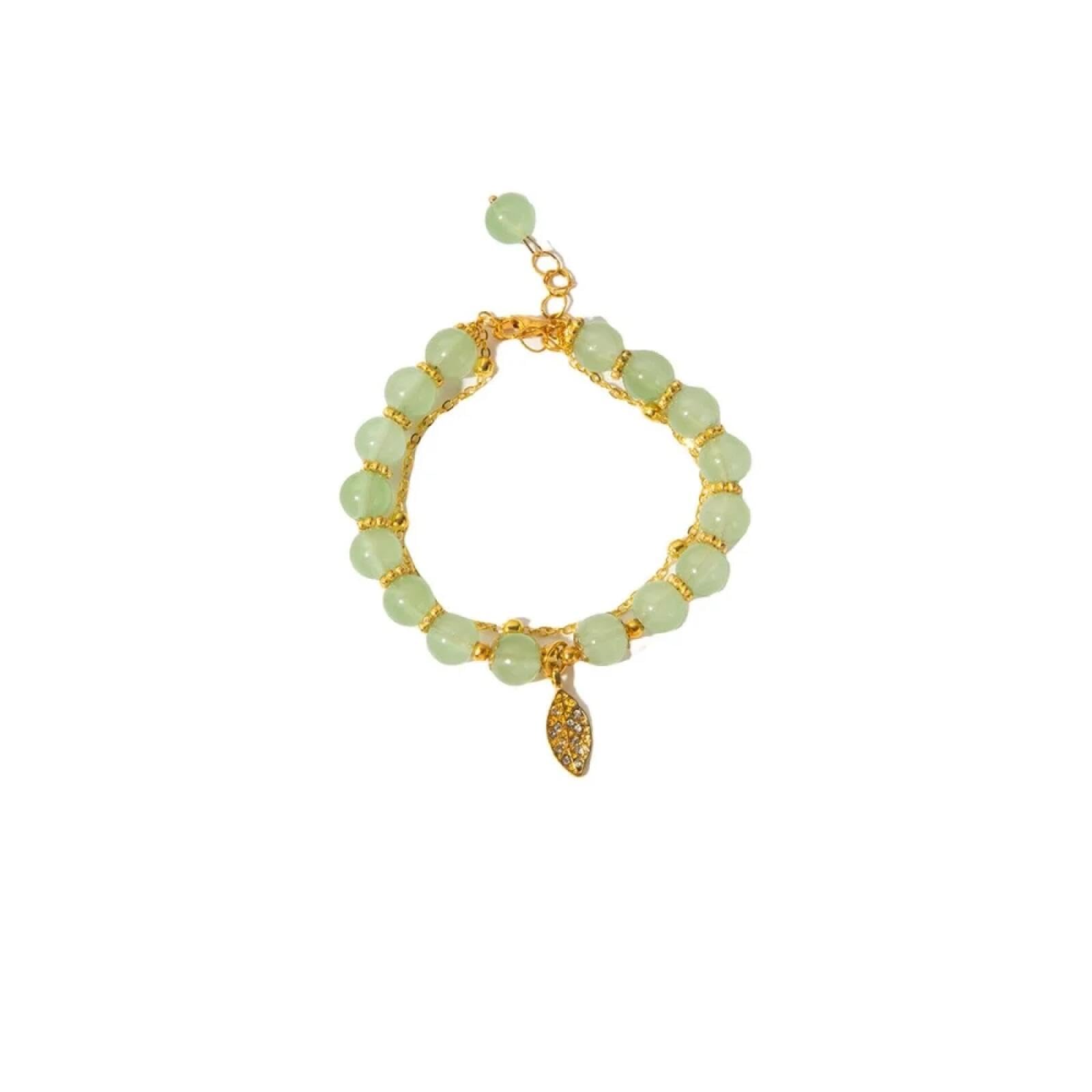 Pulsera de hojas doradas con doble cadena para lucir en eventos 6