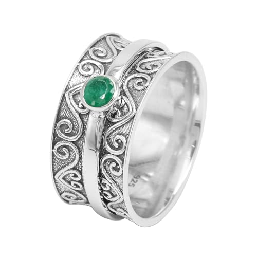 Bague anti-stress émeraude au bureau pour apaiser l'anxiété des femmes
