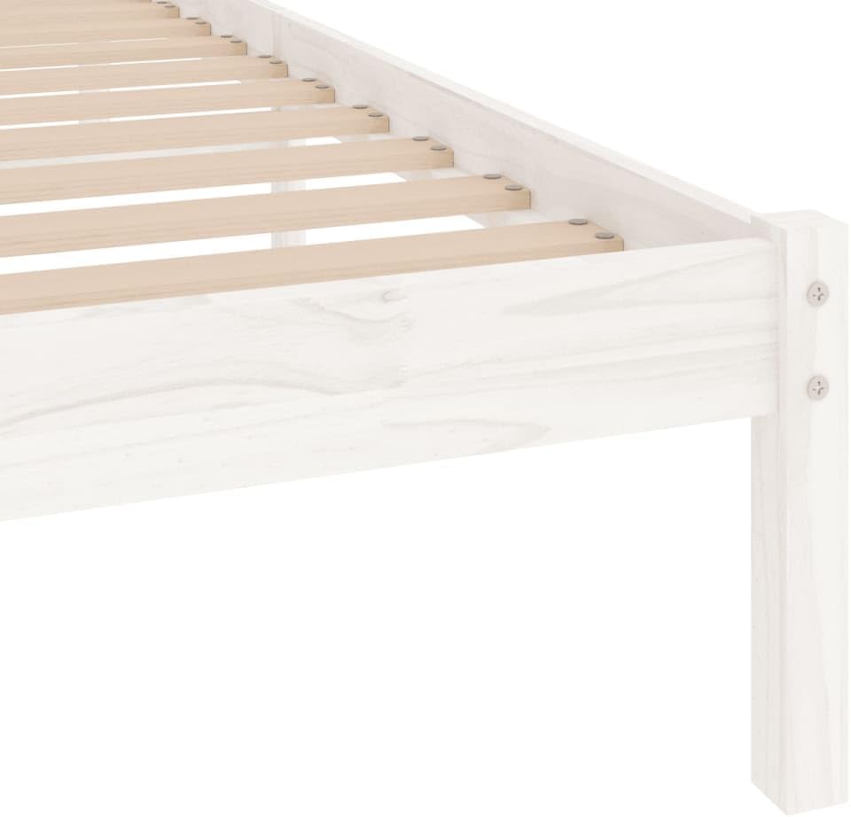 Close-up of a corner of the white solid wood bed frame, showing the joint and the attachment of the wooden slats.