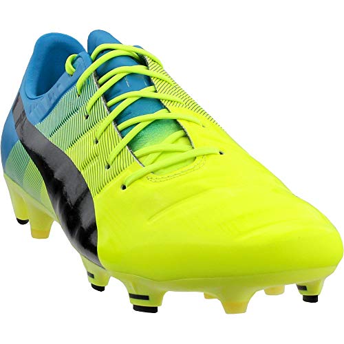 PUMA Men's Evopower 1.3 Firm Ground Sneaker, Safety Yellow/Black,...