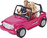 Barbie presenta un look refrescante y veraniego luciendo un vestido rosa con un estampado de colores y unos zapatos rosas decorados con lazos