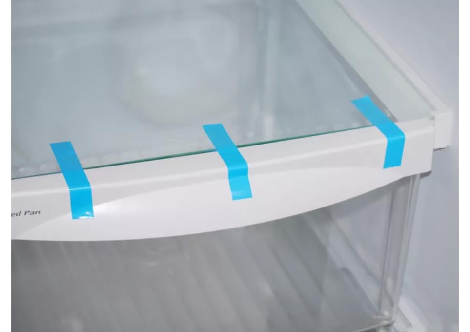 Strapping tape applied to secure shelves inside a refrigerator