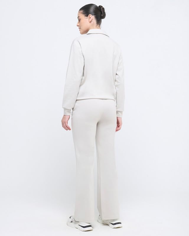Image of HUNNIT Essential Flare Pants for Women with Zip Pockets | Mid Waist Solid Cotton Tapered Flare Pants | Bootcut Flared Trousers with Wide Elastic Waistband | Relaxed Fit Flared Trouser
