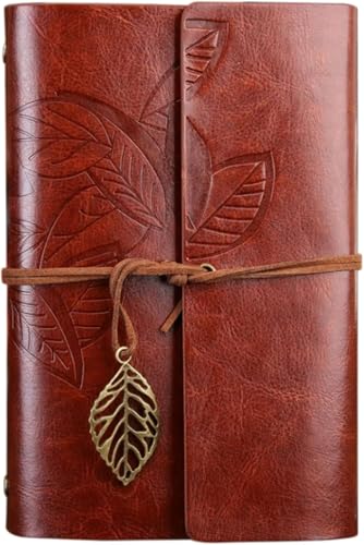 Pluma de ave vintage con cuaderno de viaje y tintero artesanal