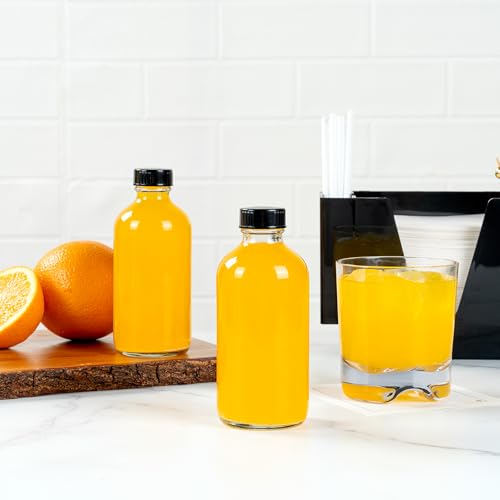 Vetri 8 oz Boston Round Clear Glass Bottle - with Black Phenolic Cap - 2 1/2" x 2 1/2" x 5 1/2" by Restaurantware - Image 7