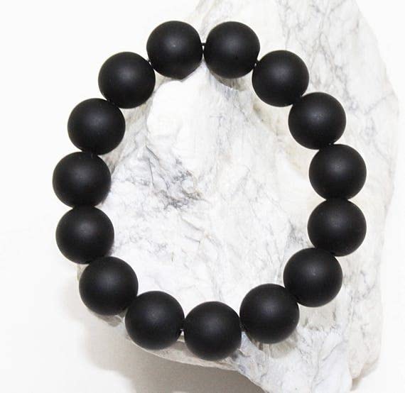 Bracelet onyx noir mat 12mm : perles rondes extensibles pour homme et femme