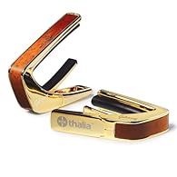 Officially licensed Gibson capo in luxurious gold finish with Sunburst inserts and Hummingbird fingerboard marker Revolutionary rubber fretpad system for perfect adjustment to the fretboard radius Even pressure distribution to stabilise tuning preven...
