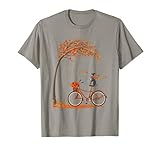 Grazioso cane levriero in autunno, divertente cane equitazione bicicletta donna bambino tee, cane carino corsa autunno bici sotto caduta mapple tree foglie sinistra