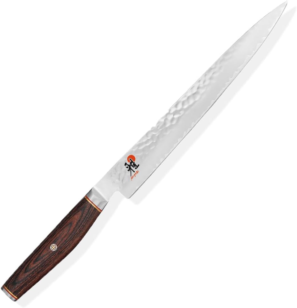 6000MCT Shujihiki 24cm. MicroCarbide MC63 powder steel Japanese blade. 3 layers. Hardness 63 Rockwell. Ice-hardened. Rust resistant. Pakka wood handle. Made in Seki, Japan.