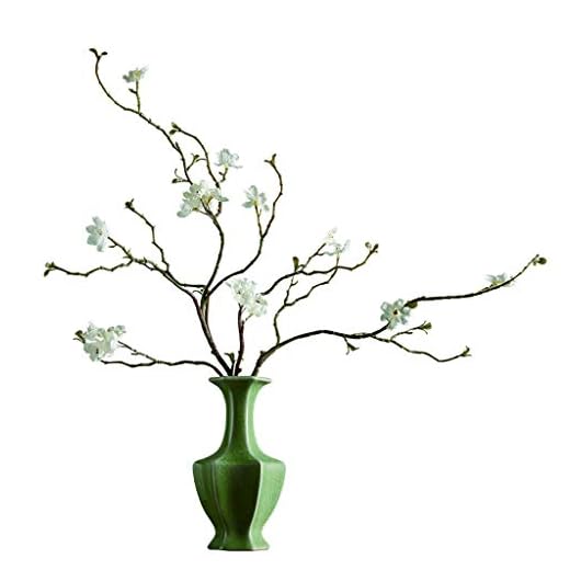 Konstgjorda blommor faux bukett Konstgjorda blommor används i vardagsrummet, teekonstrum, retro minimalistisk stil kreativ bokhylla for att placera små vita blommor