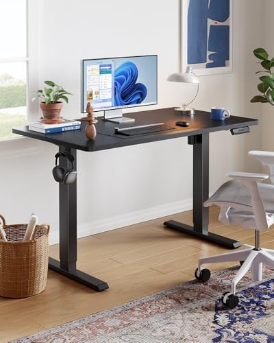 HUANUO 55" x 28" Electric Standing Desk Adjustable Height, 4 Memory Height Settings, Headphone Hook, Cable Manager, Sit Stand Up Desk for Home Office & Computer Workstation, Black