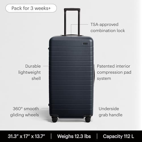 Image of Away Trunk Checked Luggage - 31-Inch Lightweight Hardside Suitcase with 360 WhisperGlide Spinner Wheels, Interior Compression System, TSA-Accepted Lock - Navy Blue