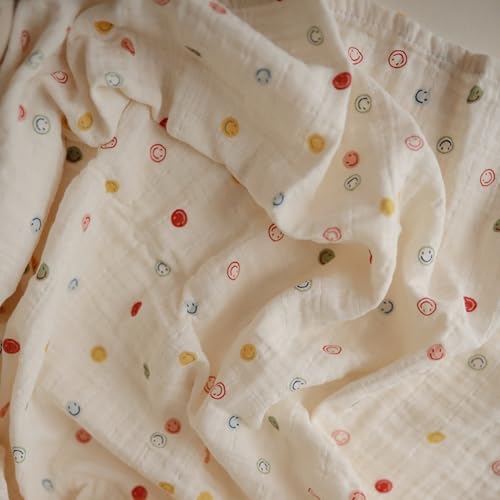 Image of mushie Muslin Baby Swaddle Blanket | 100% Organic Cotton (Smiley Face)