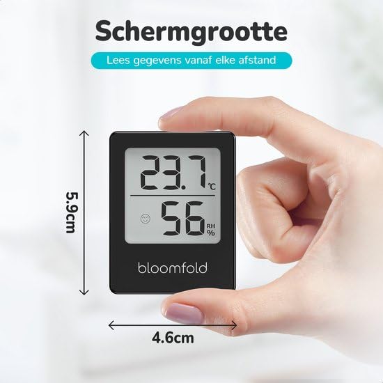 Image showing the Bloomfold hygrometer held in a hand, with dimensions 4.6cm width and 5.9cm height.