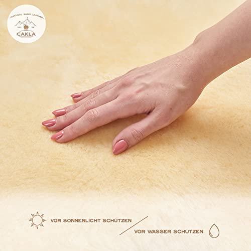 Cakla Lammfell Echt 110-120 cm - Schaffell Echt Groß - Fellteppich - Weich und Flauschig - Fell für Stühle - Lammfell Teppich - 100% Bio - Schafsfelle - Dekofell - Schafsfell Felle - Deko Fell