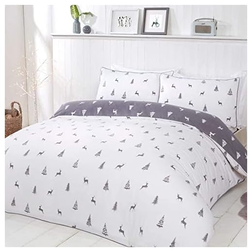 Amazon Basics Mikrofaser-Bettwäsche-Set, Schwarz, 240 cm x 220 cm / 80 cm x 80 cm x 2 4 Sleepdown Hirsch & Trees Wende-Bettwäsche-Set mit Kissenbezügen, warm, gemütlich, Thermo-Flanell, 100 % gebürstete Baumwolle, Super-King-Size-Bett (260 x 230 cm)
