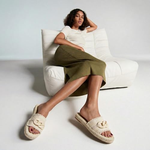 Image of CUSHIONAIRE Lucia Raffia Bow Espadrille Sandals for Women, Woven Straw Flat Slide Summer Sandals with Cushioned Footbed