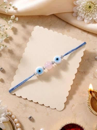 Image of Karatcart Elegant Pink Bead Handmade Evil Eye Rakhi for Brother with Roli & Chawal