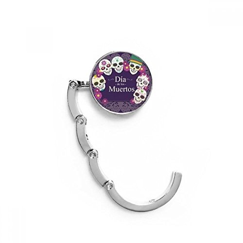 Gancho plegable del bolso con diseño de calavera para colgar en mesas