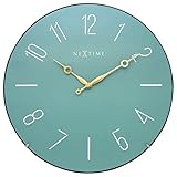 The curved glass front and the reduced design gives the wall clock DOME by NeXtime an elegant look.