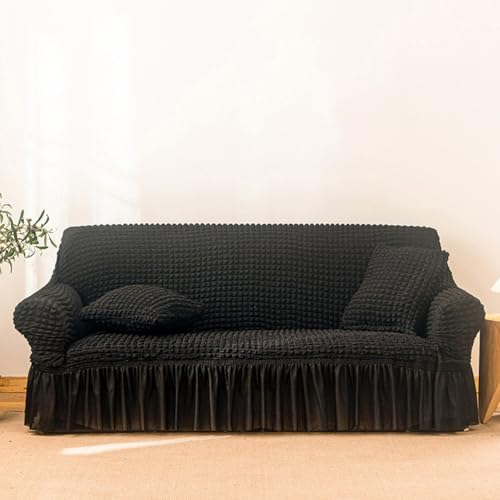 Housse de canapé extensible avec jupe pour un salon chaleureux lors des soirées