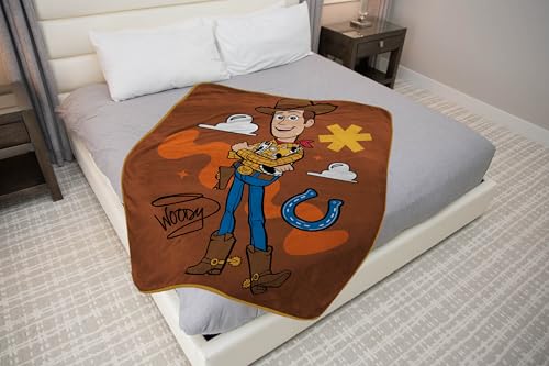 Image of Jay Franco Plush Throw Blanket - 46 inch x 60 inch Inches Kids Hero Soft & Cozy Fleece Throw for Bedroom & Couch Decor, Official Licensed Product, Brown - Toy Story Woody