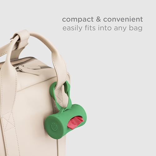 Image of Ubbi Retractable Dog Poop Bag Holder and Dispenser with Silicone Strap Leash Attachment, Includes 2 Rolls of Lavender Scented Leakproof Waste Bags, Green