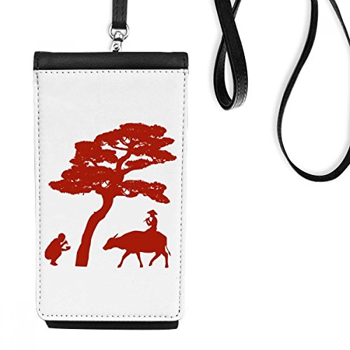 Téléphone noir suspendu dans sa pochette en cuir au motif silhouette de vache chine pour voyage