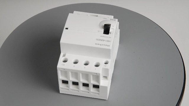 Produktbild von Heschen HS1-63M/31 Schütz 63A 4-polig – 3NO 1NC, 220V AC, DIN-Schiene, Mit Manuellem Schalter