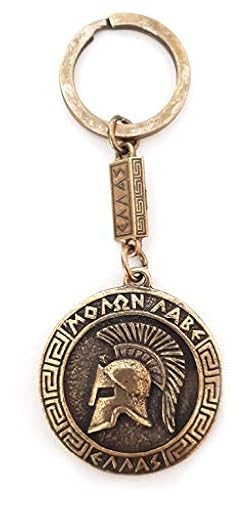 IconsGr Llavero antiguo espartano con casco de batalla espartano, llavero de escudo de monedas de la película 300, oro | Ya disponible en tu tienda friki favorita! En mundofriki.es!