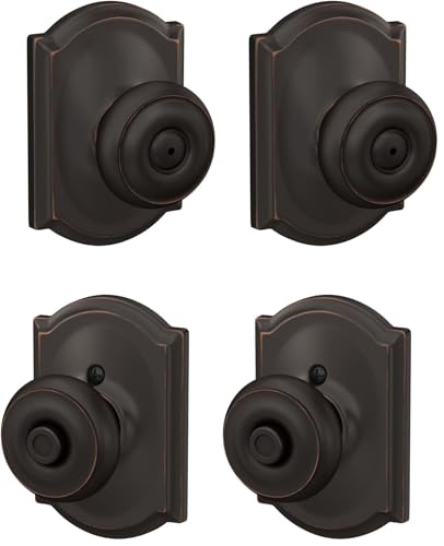 Image of SCHLAGE F40 GEO 716 CAM Georgian Door Knob with Camelot Trim, Bed & Bath Privacy Lock, Aged Bronze (Pack of 2)