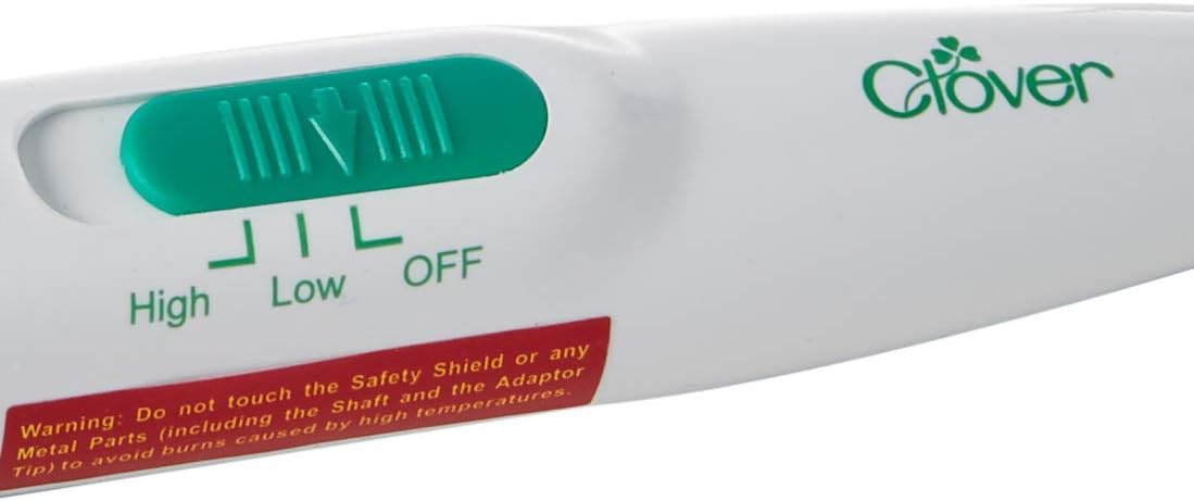 Clover MCI-900 Mini Iron with dimensions overlay, showing its compact size