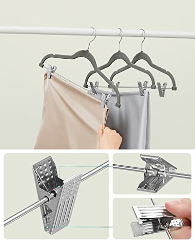 Image of SONGMICS Velvet Hangers with Clips, 12 Pack, 42.5 x 23.5 x 0.6 cm | Space Saving Hangers for Skirts and Trousers, Non-Slip, Adjustable Clips, Grey, BREANNA Collection CRF12V