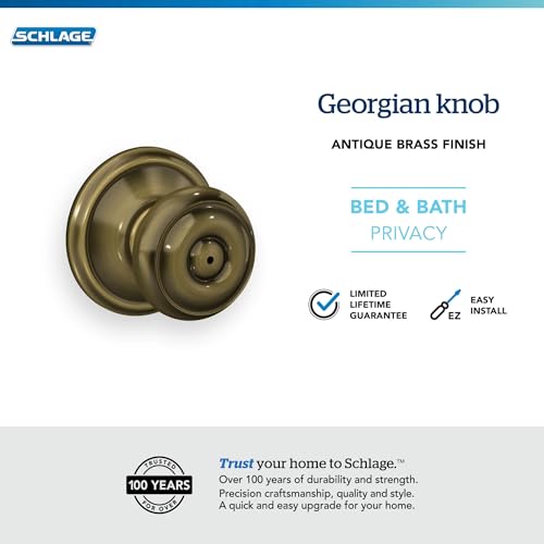 Image of Schlage F40 GEO 609 Georgian Door Knob, Bed & Bath Privacy Lock, Antique Brass