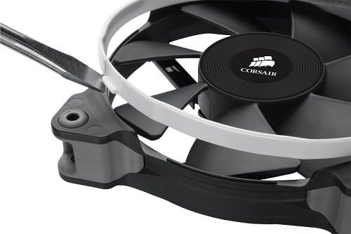 Close-up of a hand installing a white interchangeable ring onto a Corsair SP120 fan.