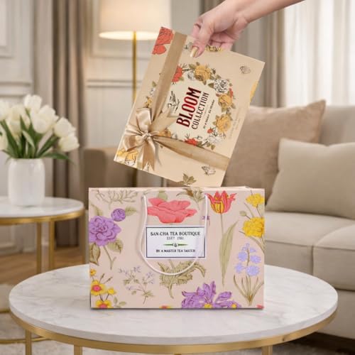 Image of Sancha Tea Boutique, Bloom Collection Tea Gift Box | English Breakfast, Darjeeling & Masala Chai | 3 x 25 Pyramid Tea Bags | Premium Floral Gift Box with Golden Ribbon & Carry Bag