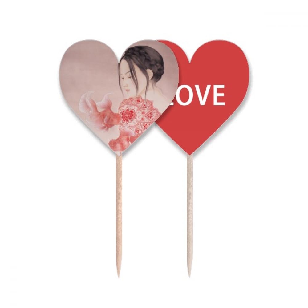 Papier découpé peinture chinoise pic cupcake cœur contre table banale